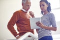 Business people, building and tablet at staircase for teamwork, collaboration or thinking with manager. Professional Royalty Free Stock Photo