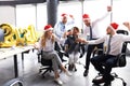 Business people are celebrating holiday in modern office drinking champagne and having fun in coworking Royalty Free Stock Photo