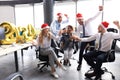 Business people are celebrating holiday in modern office drinking champagne and having fun in coworking Royalty Free Stock Photo