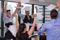 Business people celebrating by throwing their business papers and documents fly in air, Power of cooperation, Success teamwork Royalty Free Stock Photo