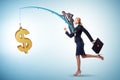 Business people chasing dollar on fishing rod Royalty Free Stock Photo