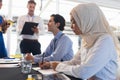 Business people checking in at conference registration table Royalty Free Stock Photo