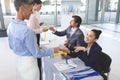 Business people checking in at conference registration table Royalty Free Stock Photo