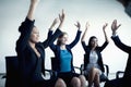 Business people cheering with arms in the air Royalty Free Stock Photo