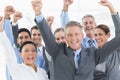 Business people cheering in office Royalty Free Stock Photo