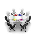 Business people with colored jigsaw puzzle, teamwork concept.