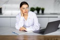 Business and people concept - stressed or tired young woman with laptop computer working at home office Royalty Free Stock Photo