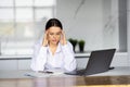 Business and people concept - stressed or tired young woman with laptop computer working at home office Royalty Free Stock Photo