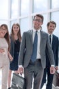 Business people confidently walking in a modern office building Royalty Free Stock Photo