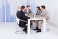 Business People Discussing At Conference Table Royalty Free Stock Photo