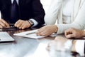 Business people discussing contract working together at meeting in modern office. Unknown businessman and woman with Royalty Free Stock Photo