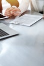 Business people discussing contract while working together in sunny modern office. Unknown businessman and woman with Royalty Free Stock Photo