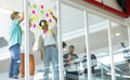 Business people discussing over sticky notes in the office Royalty Free Stock Photo