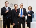 Business people drinking water at water cooler Royalty Free Stock Photo