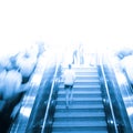 Business people on escalator Royalty Free Stock Photo