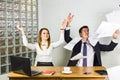 Business people excited happy smile, throw papers, documents fly in air, businesspeople sitting at office desk hold Royalty Free Stock Photo