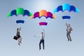 The business people falling down on parachutes Royalty Free Stock Photo