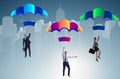 Business people falling down on parachutes Royalty Free Stock Photo