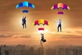 The business people falling down on parachutes Royalty Free Stock Photo