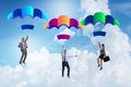 The business people falling down on parachutes Royalty Free Stock Photo