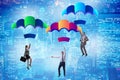 The business people falling down on parachutes Royalty Free Stock Photo