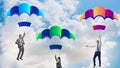 Business people falling down on parachutes Royalty Free Stock Photo