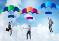 Business people falling down on parachutes Royalty Free Stock Photo