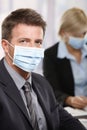 Business people fearing h1n1 virus