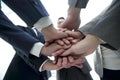 Business people folding their hands together. Royalty Free Stock Photo