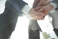 Business people folding their hands together. Royalty Free Stock Photo