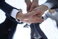 Business people folding their hands together. Royalty Free Stock Photo