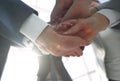 Business people folding their hands together. Royalty Free Stock Photo