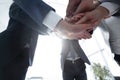 Business people folding their hands together. Royalty Free Stock Photo