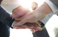 Business people folding their hands together. Royalty Free Stock Photo