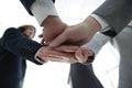 Business people folding their hands together. Royalty Free Stock Photo