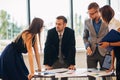 Business people gathered together at a table discussing an idea Royalty Free Stock Photo