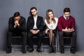 Business People Are Getting Bored While Sitting On Chair Waiting For Job Interview In Office