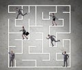Business people getting lost in maze uncertainty concept Royalty Free Stock Photo