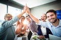 Business people giving high five at desk Royalty Free Stock Photo