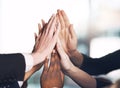Business people giving high five for motivation, unity, and support in a meeting together at work. Closeup of hands of Royalty Free Stock Photo