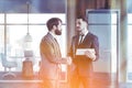 Business people in gray coworking office hall Royalty Free Stock Photo