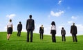 Business People in a Green Field Royalty Free Stock Photo