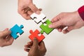 Business people group assembling jigsaw puzzle and represent team support Royalty Free Stock Photo