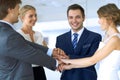 Business people group joining hands and representing concept of friendship and teamwork. Royalty Free Stock Photo