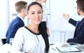 Business People group at meeting in office. Focus at beautiful cheerful smiling businesswoman. Conference, corporate Royalty Free Stock Photo