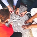 Business, people and group with puzzle on floor for team building, common goal and problem solving in workplace. Top