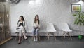 Business people group sitting in row on chairs, three job applicants await for their turn in queue Royalty Free Stock Photo