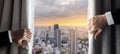 Business people hand opening curtain with Osaka city view in the morning sunrise. New day concept