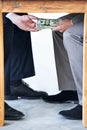 Business people, hands and money with table for bribery and corruption in company with money laundering. Illegal Royalty Free Stock Photo