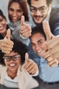 Business people, hands and thumbs up above for winning, success or teamwork at the office. Top view of employee group Royalty Free Stock Photo